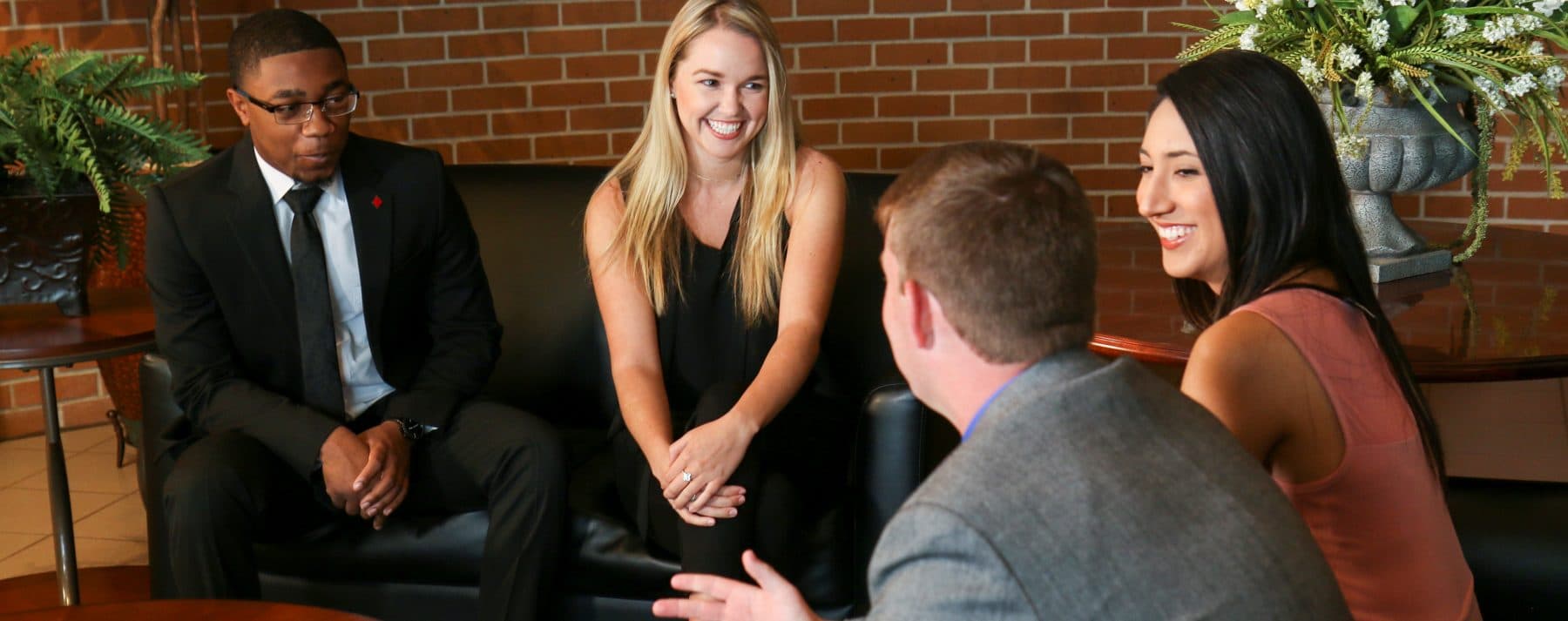 Rankin College of Business students in professional dress talking together