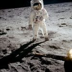 Astronaut Buzz Aldrin walks on the surface of the moon near the leg of the lunar module Eagle during the Apollo 11 extravehicular activity (EVA).