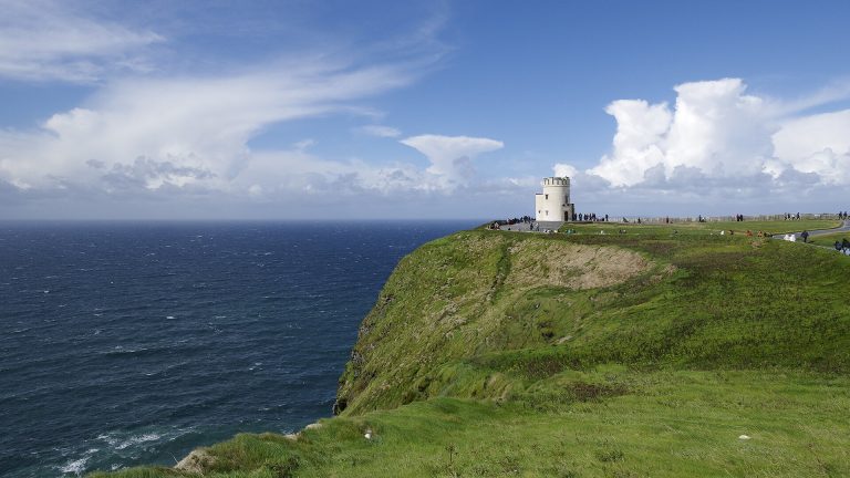 O'Brien's Tower on the green clifftop of the Cliffs of Moher above the Atlantic